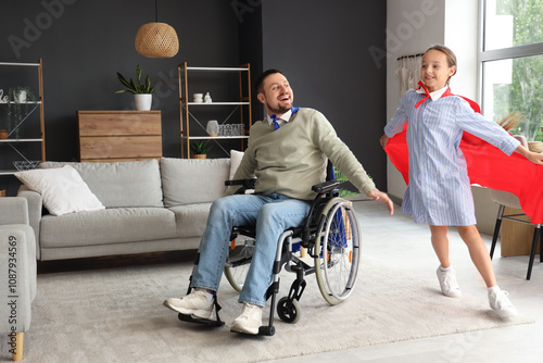 Father in wheelchair and hi...