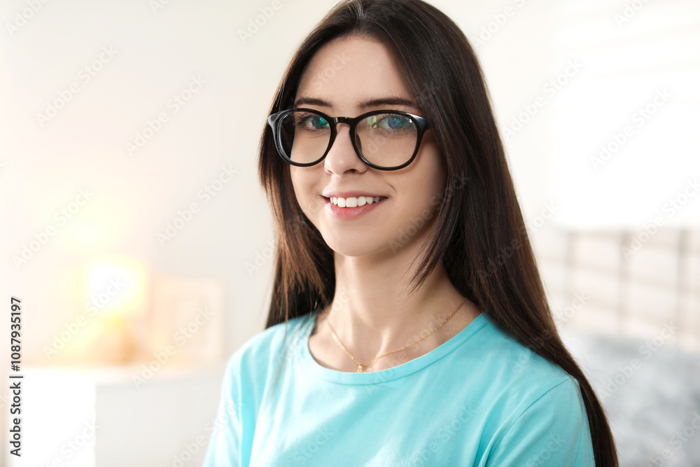 Portrait of happy teenage girl in glasses at home Portrait of happy teenage girl in glasses at home