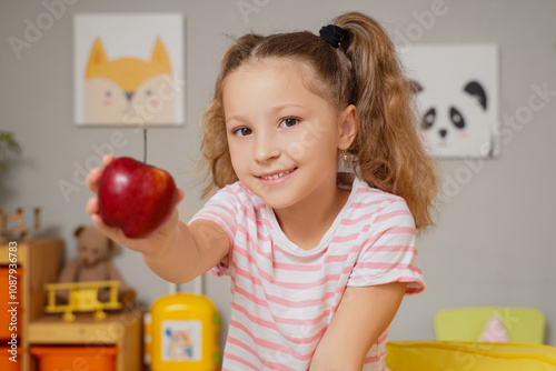 Cute little girl with red a...