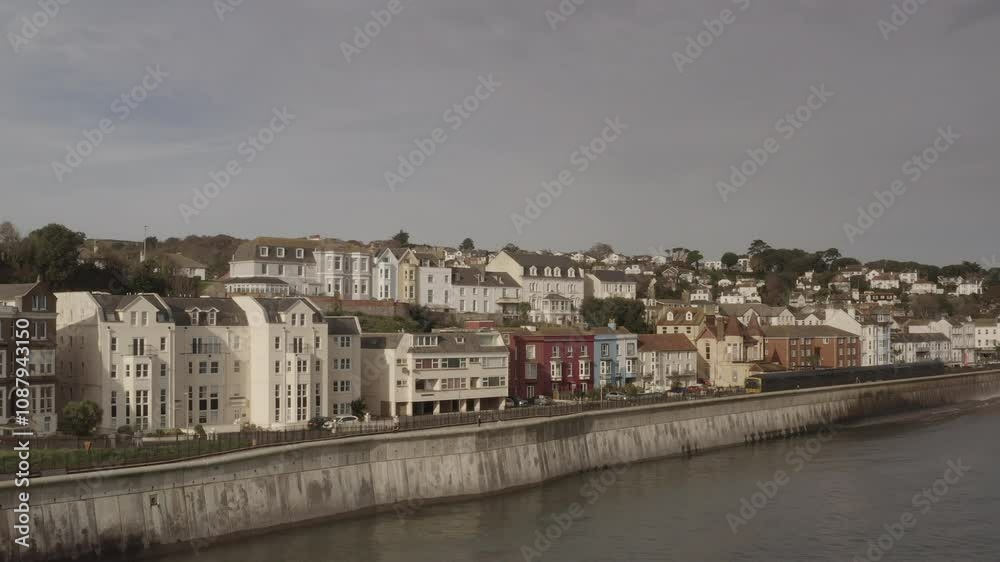 Aerial view of Dawlish with rail track on the coast seaside town in Devon Drone UK 4K Aerial view of Dawlish with rail track on the coast seaside town in Devon Drone UK 4K
