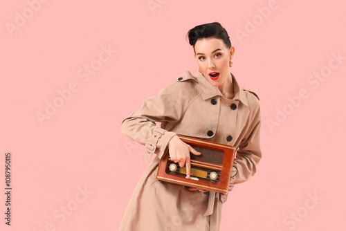 Young pin-up woman in coat ...