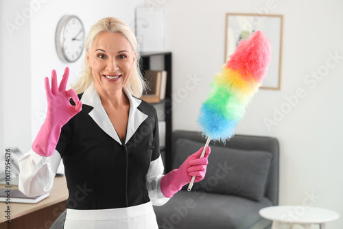 Smiling mature housekeeper ...