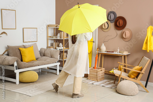 Woman with raincoat and ope...
