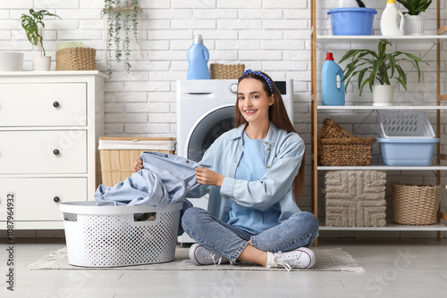 Smiling young woman sitting...