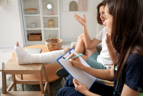 Young woman with broken leg...