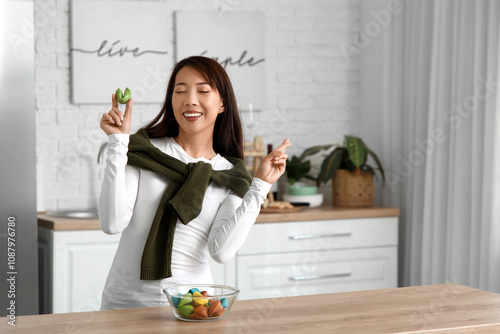 Young Asian woman with colo...
