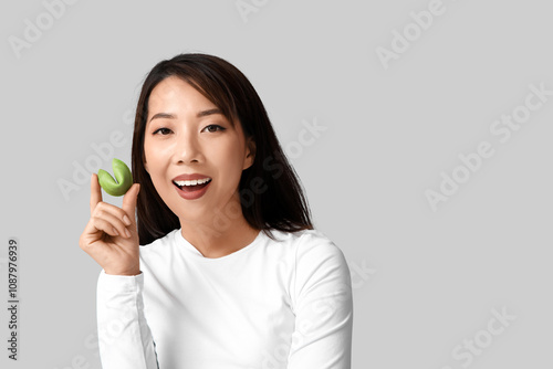 Young Asian woman with fort...
