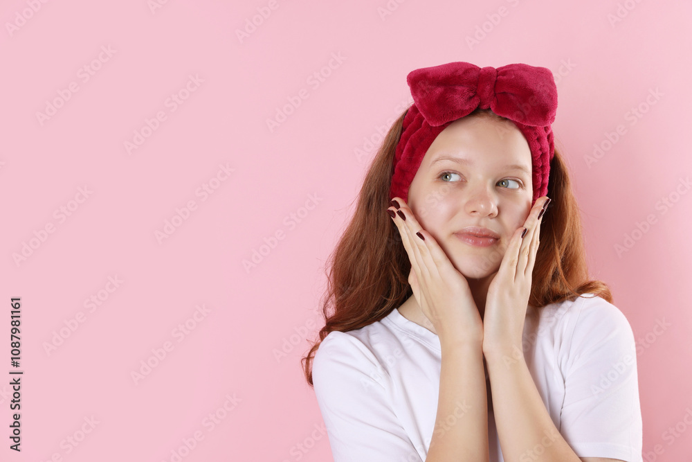 Portrait of teenage girl with headband on pink background, space for text Portrait of teenage girl with headband on pink background, space for text