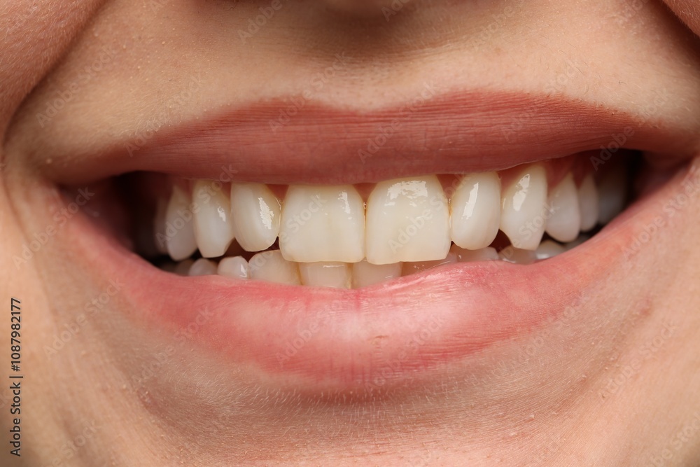 Fototapeta premium Woman smiling with her teeth, closeup view
