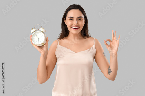 Young woman in pajamas with...