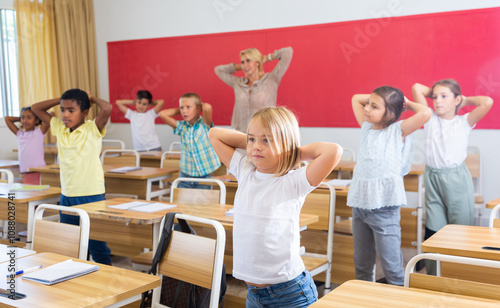 Gymnastics in the classroom in elementary school photo