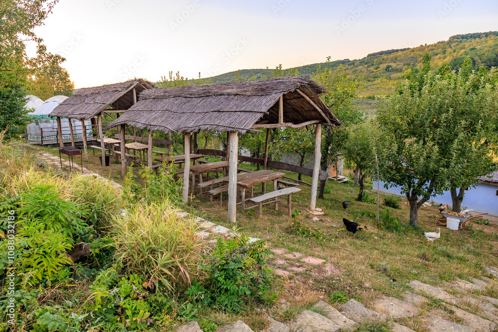 Fototapeta premium A small village with a few tables and a few buildings