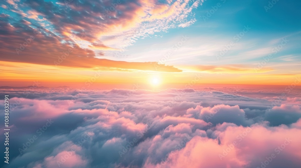 A stunning sunset paints the sky with warm hues, casting a serene glow over a blanket of soft clouds in the sky A stunning sunset paints the sky with warm hues, casting a serene glow over a blanket of soft clouds in the sky