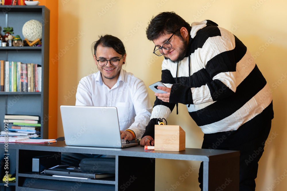 Fototapeta premium Two young men working from home