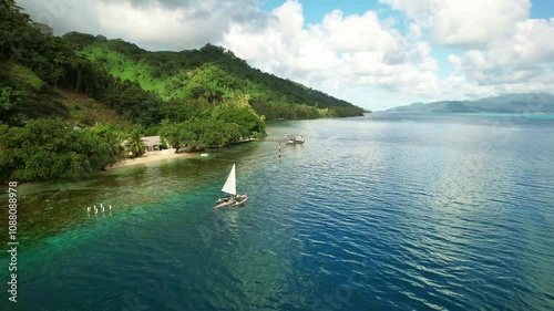 Wallpaper Mural Drone Tahiti. Aerial view of Tahaa island lagoon, traditional canoe in clear ocean water, mountain jungle island coastline. Luxury honeymoon vacation. tourism destination in French Polynesia.  Torontodigital.ca
