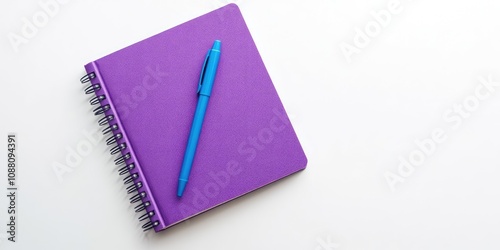 Top view of a purple notebook and blue pen on a white background. Suitable for school or office wallpaper. Flat lay, copyspace.