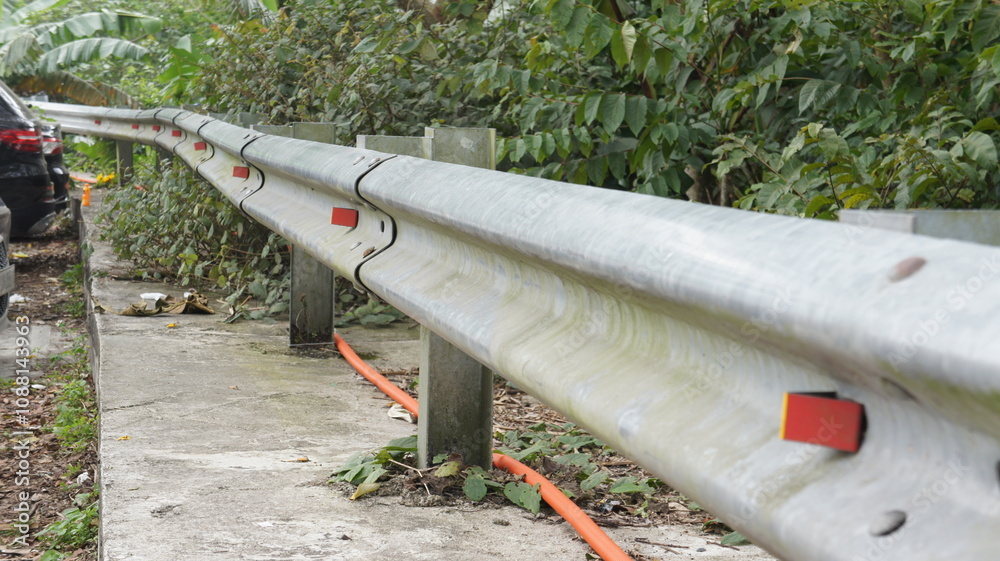 Metal Guard Rail Alongside Road with Reflective Markers Metal Guard Rail Alongside Road with Reflective Markers