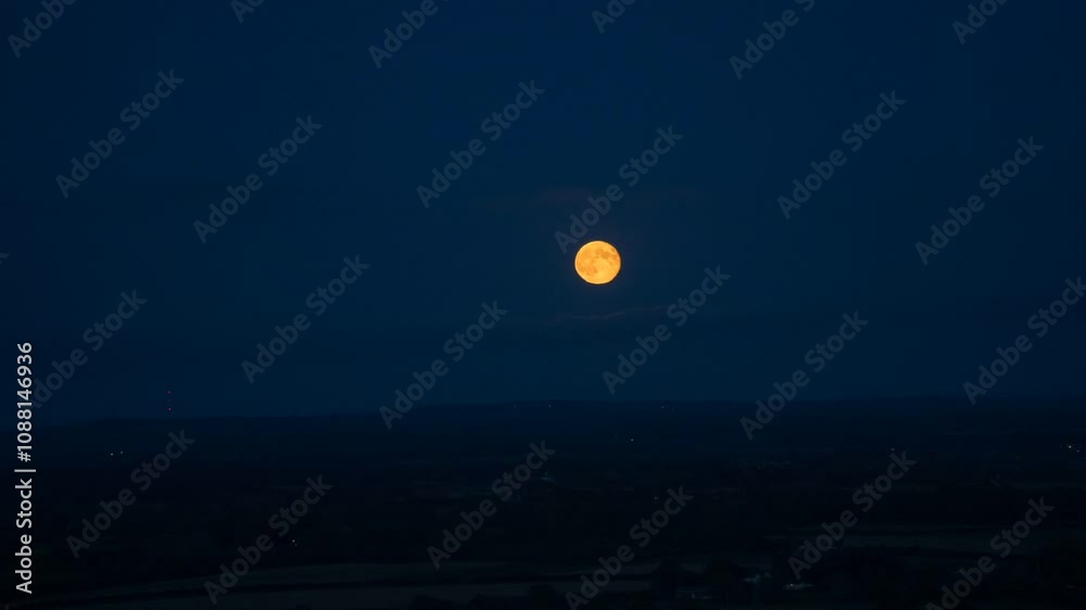 Blood Moon Rising Through Clouds over Countryside. Blood Moon Rising Through Clouds over Countryside.