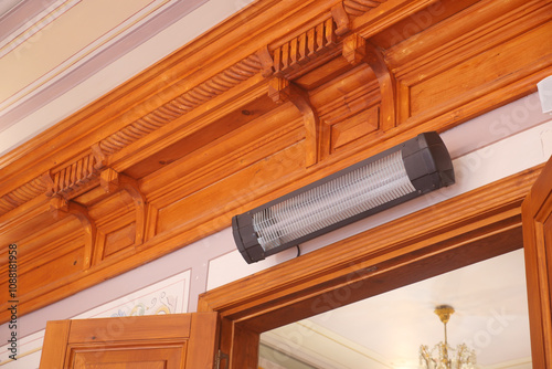 Modern electric infrared heater on celling  photo