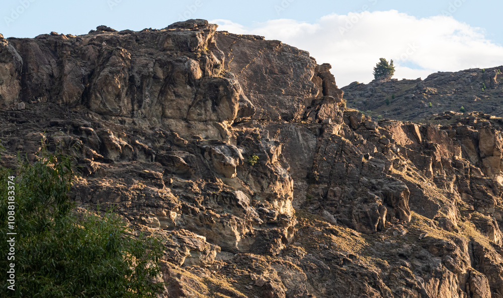 Beautiful mountains rugged in sunset sunlight Roxburgh Gorge New Zealand