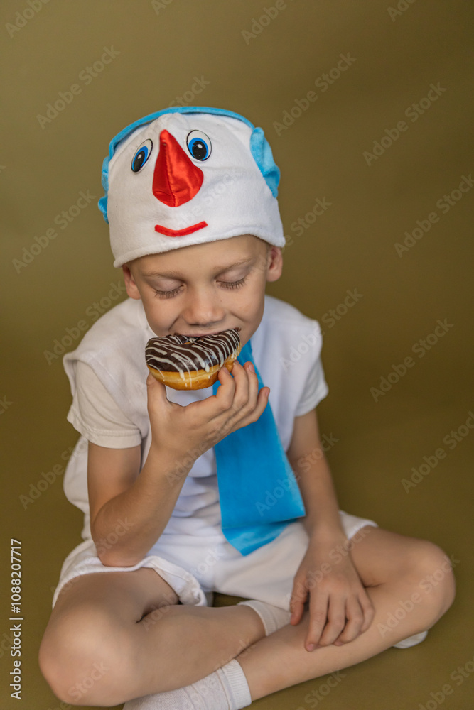 boy bites a chocolate donut boy bites a chocolate donut
