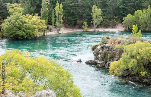 Beautiful blue river flowing nature scenery Clutha New Zealand green trees