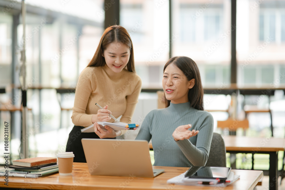 Group of asia business people sitting and talking, meeting, presenting, presenting graphs, chatting happily at the office. Group of asia business people sitting and talking, meeting, presenting, presenting graphs, chatting happily at the office.