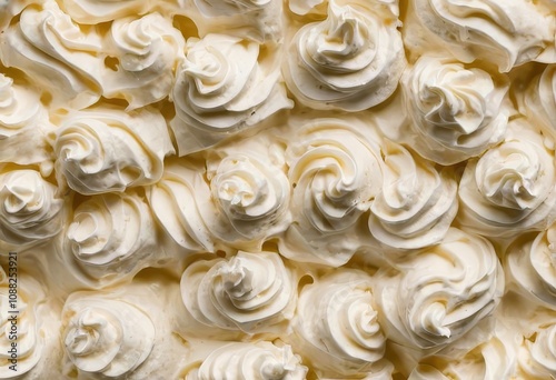 A close-up photo of a cake with textured frosting and colorful sprinkles