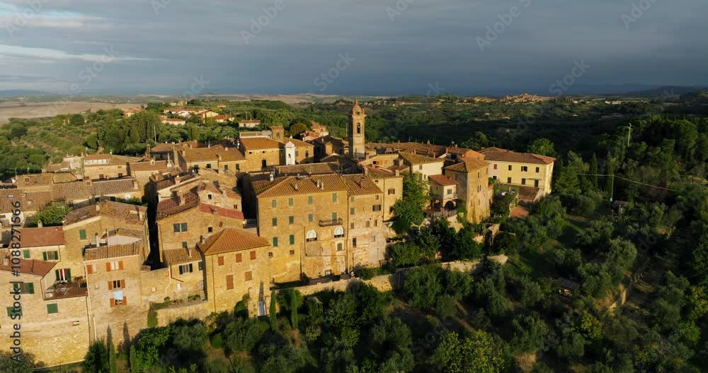 Mountaintop Settlements Of Castelmuzio During Sunrise In Siena, Tuscany, Italy. Aerial Drone Shot Mountaintop Settlements Of Castelmuzio During Sunrise In Siena, Tuscany, Italy. Aerial Drone Shot