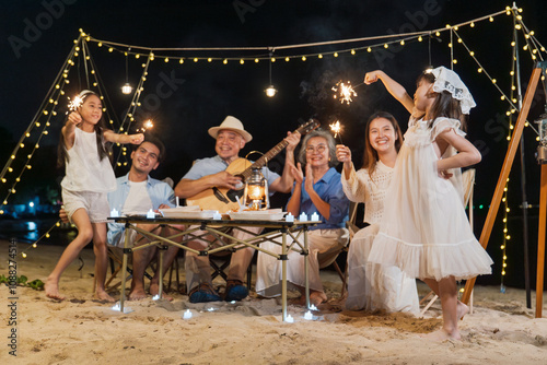 Group of multi generation family little girl with parents and grandparents relax and enjoy together camping on the beach.