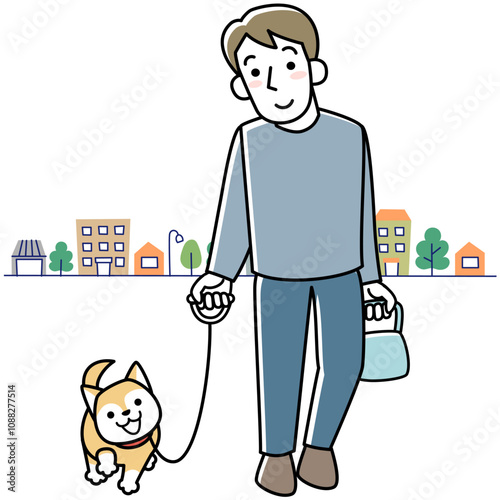 笑顔で犬の散歩をする若い男性