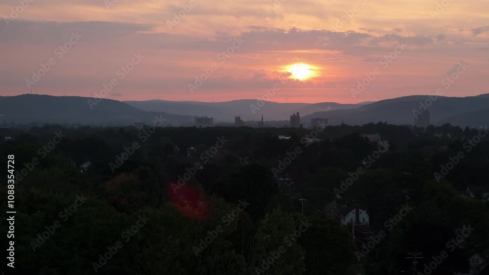 Aerial view of Binghamton, New York at sunrise. Shot during the summer in 4k. Aerial view of Binghamton, New York at sunrise. Shot during the summer in 4k.