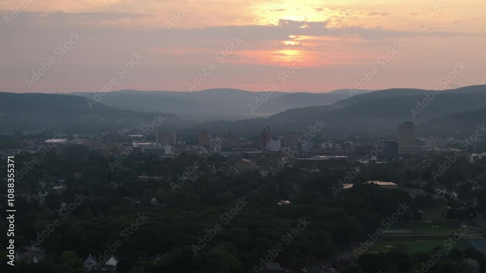Drone shot of Binghamton, New York at sunrise. Shot during the summer. Drone shot of Binghamton, New York at sunrise. Shot during the summer.