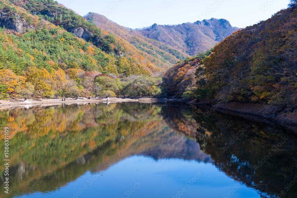 mountain and reflection on the lake in autumn