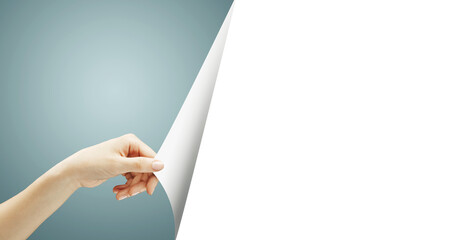 A hand turns a white page, revealing a blank space on the right side with a blue gradient background on the left. Clean, minimalistic design template