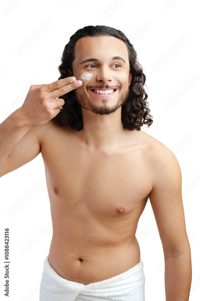A young man demonstrates skincare routine with moisturizer on his face A young man demonstrates skincare routine with moisturizer on his face