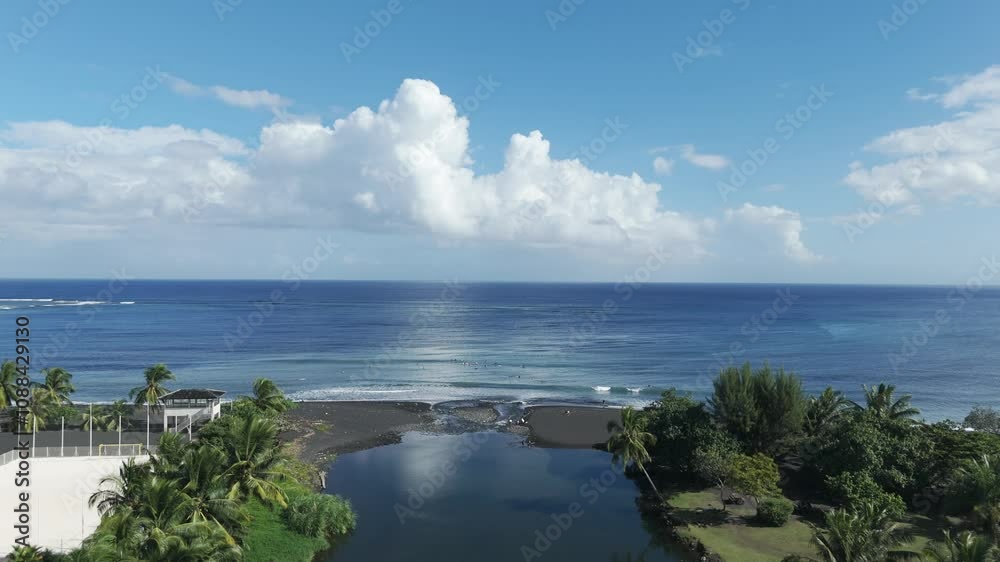 Aerial View Of Taharuu Beach With Surfers Surfing In The Blue Ocean In Summer In Aerial View Of Taharuu Beach With Surfers Surfing In The Blue Ocean In Summer In