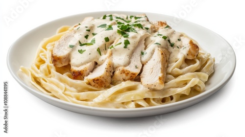 A plate of creamy chicken Alfredo pasta with tender chicken breast strips, fettuccine pasta, and creamy Alfredo sauce