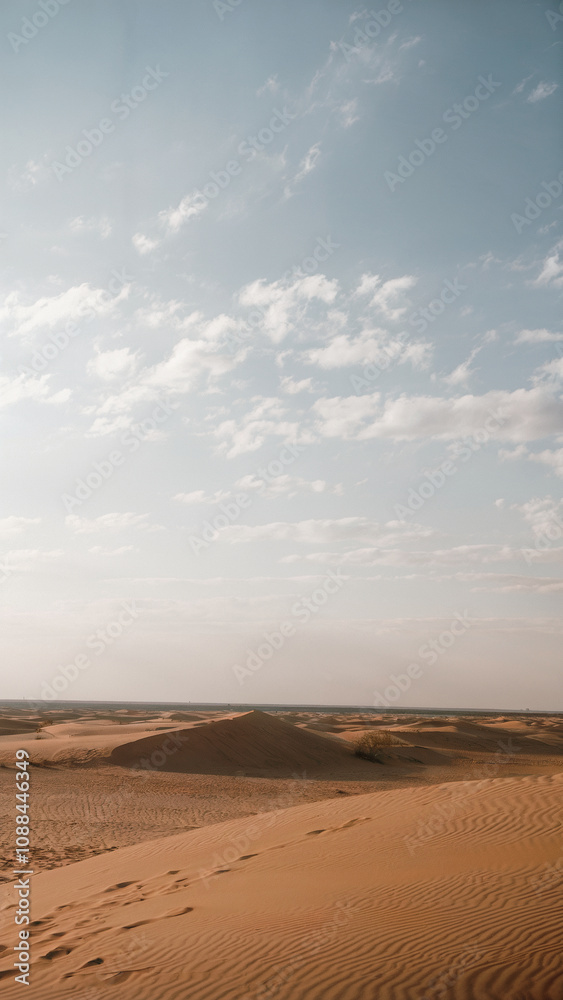 Desert landscape with a large hill in the distance Desert landscape with a large hill in the distance