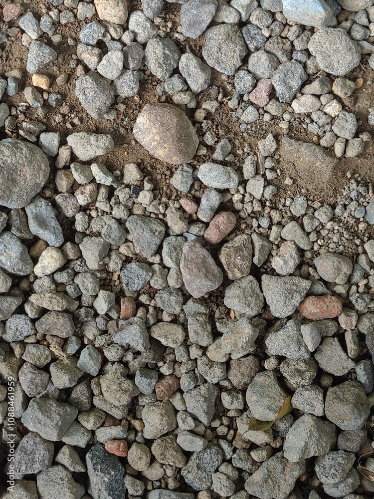 Assorted Natural Stones and Gravel on Dirt Background Assorted Natural Stones and Gravel on Dirt Background