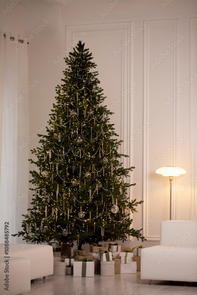 Fototapeta premium A large Christmas tree with lights and ornaments sits in a white room
