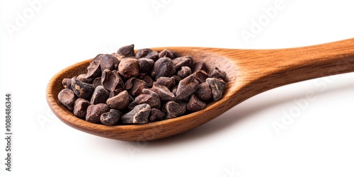 Cocoa nibs in a wooden spoon are featured against a white background. These crunchy cocoa nibs, made from peeled and roasted cocoa beans, offer a delightful chocolate bitterness. A sugar free design