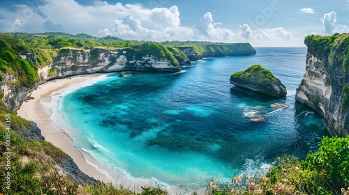 Wide-angle view of Broken Beach, focusing on the circular cove with sparkling blue water, rugged cliffs, and green vegetation along the edges photo