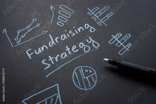 Handwritten notes about fundraising strategy. Resource development. photo