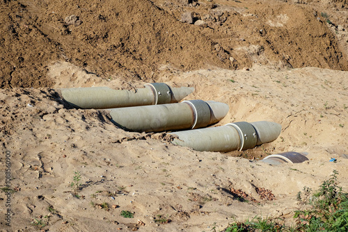 Wallpaper Mural New fiber glass water pipeline in trench. Replacement of old rusty tubes by new one Torontodigital.ca