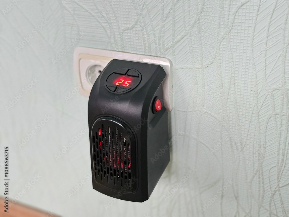 Modern electric compact and fan heaters indoors
