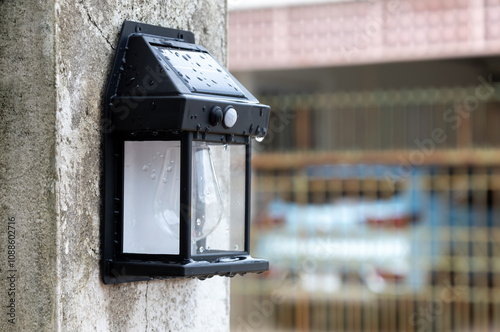 solar powered lights hanging on the fence