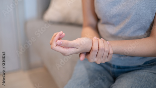 Photos Woman female suffering from wrist sprain arthritis inflammation from physical in