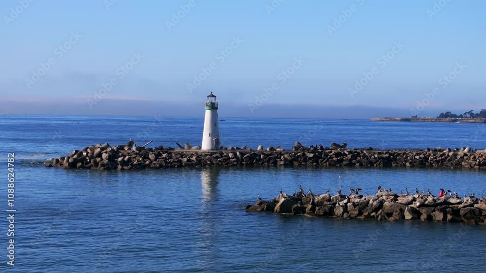Walton Lighthouse Monterey Bay Santa Cruz California USA aerial drone scenic landscape deep blue Pacific Ocean seagull pelican birds marina harbor jetty morning blue sky mist fog circle left parallax Walton Lighthouse Monterey Bay Santa Cruz California USA aerial drone scenic landscape deep blue Pacific Ocean seagull pelican birds marina harbor jetty morning blue sky mist fog circle left parallax