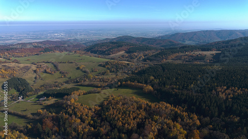 Mountains covered with colorful autumn trees, autumn mountain aerial landscape. Drone view